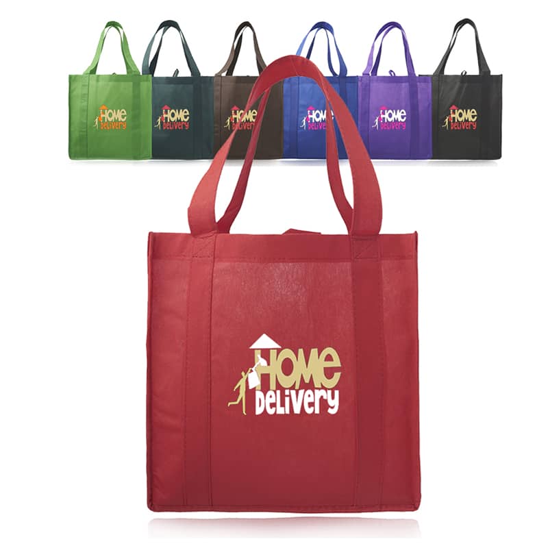 Custom non-woven small tote bags in a bright blue color, featuring reinforced straps and a large gusset, with a logo printed on the front